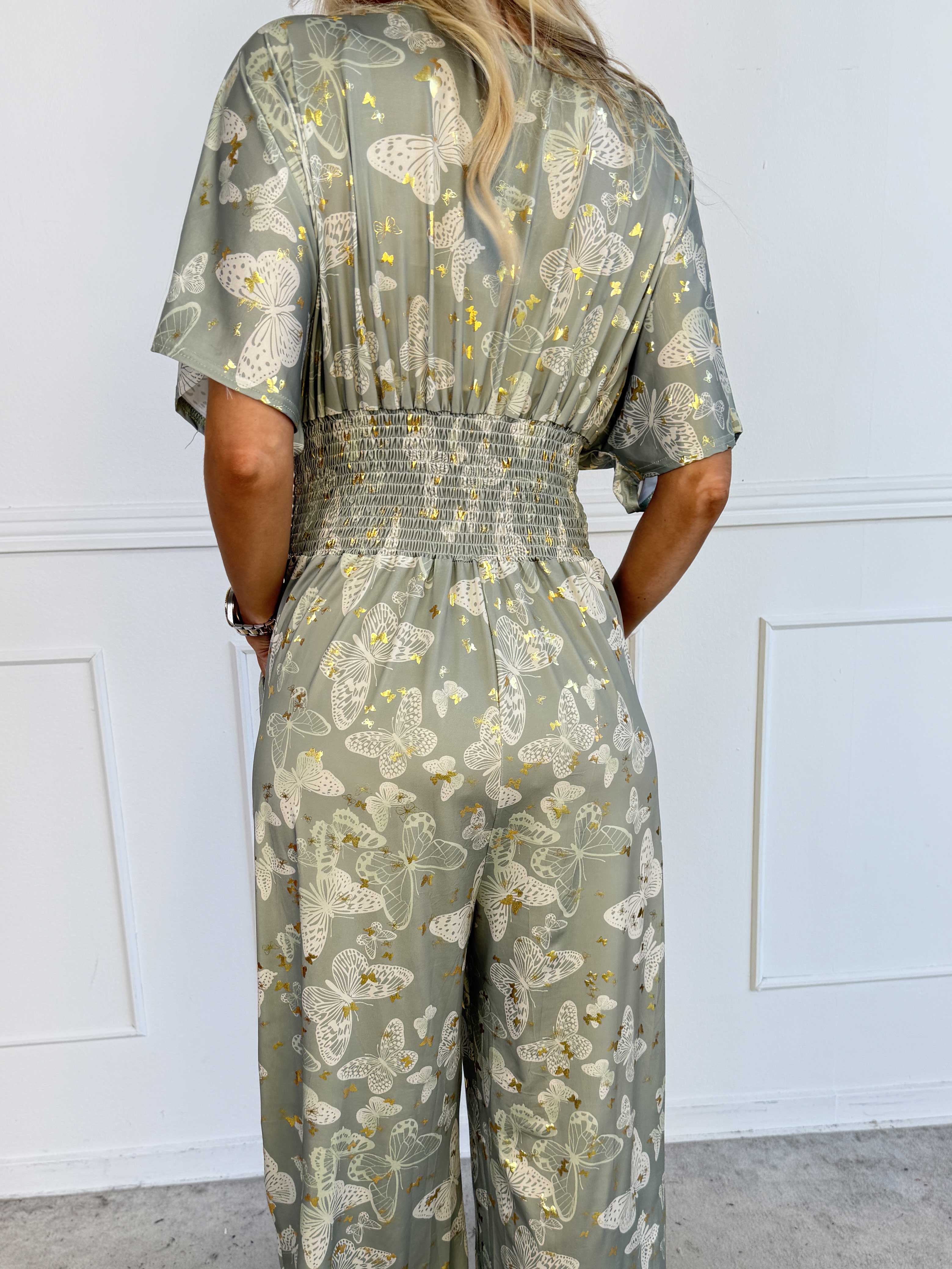 Pams Butterfly Jumpsuit - Elastisk plus size jumpsuit med fjärilsmönster
